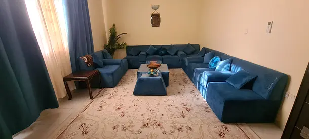 Elegant Blue Sofa Set with Matching Rug