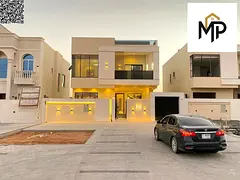 A villa in a prime location near Azha Complex, featuring two floors and a rooftop terrace, five bedr