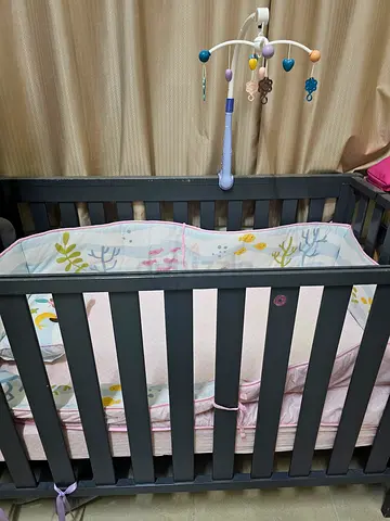 Well-Maintained Baby Crib with matress, pillow and side protector and bed sheets