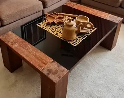 Elegant Dark Glass Coffee Table with Rustic Wooden Legs