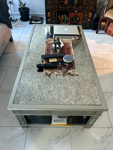 The One -Elegant Mirrored Coffee Table with Intricate Details