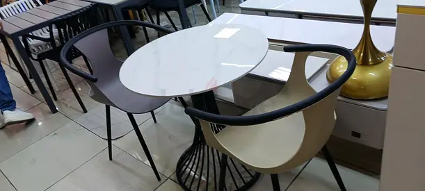 Stylish Round Dining Table with Modern Chairs