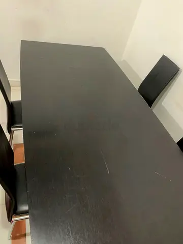 Sturdy Black Dining Table with Stylish Chairs