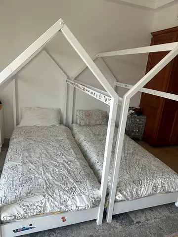 Charming White Canopy Beds including mattresses.