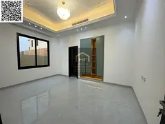 Villa for sale in Al Alia, Ajman. 5 master bedrooms, majlis, 2 living rooms, spacious kitchen, and m