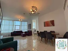 Two bedroom apartment with a living room and panoramic creek view in Orient Towers – Ajman. Spacio
