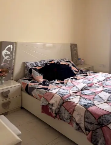 Elegant and Cozy Bed Set with Stylish Nightstands