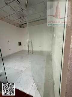 For sale in Ajman, a commercial building in Al Rawda 3, on a main street - G+1 corner lot with 3 str