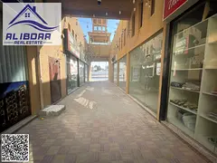 Commercial shops with mezzanine for rent in Ajman, Al Hamidiya area.