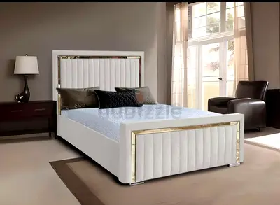 Elegant Queen-Size Bed with Gold Accents