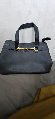 Elegant Black Handbag with Gold Accents