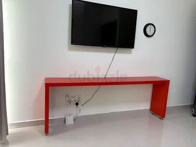Ikea Sleek orange table with wheels