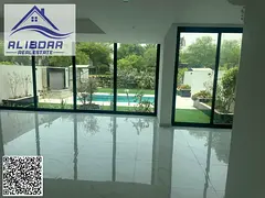 Luxury villa with a spacious area and swimming pool for sale in Al Zorah area