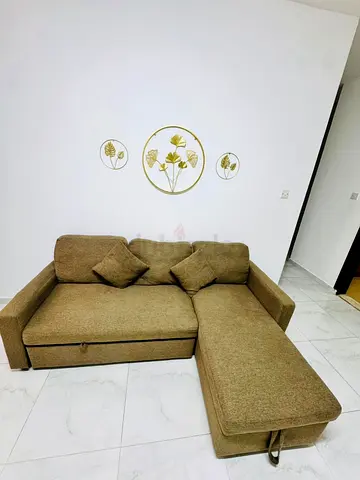 Comfortable L-Shaped Sofa with Decorative Cushions