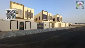 A luxurious villa located in the Al-Haliou area, boasting a prime location and a modern design that