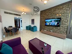 Two bedroom apartment with a living room and panoramic creek view in Orient Towers – Ajman. Spacio