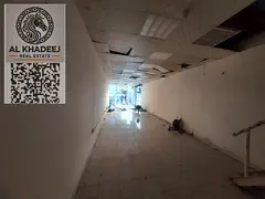 Annual commercial shop for rent in Ajman – Al Rashidiya 1, prime location on a main road near Pear