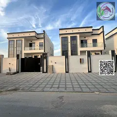 A luxurious villa located in the Al-Haliou area, boasting a prime location and a modern design that