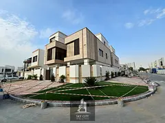 Luxury villa with a modern design, high-end finishes, a garden, a private pool, an elevator, and cen