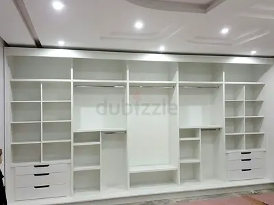 Spacious White Wardrobe with Shelves and Drawers