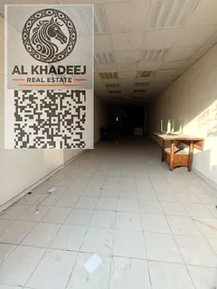 Commercial shop for annual rent in Al Rashidiya 1 Ajman, 1,500 sq.ft with mezzanine, prime main road