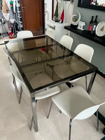 Elegant Glass Dining Table with Modern White Chairs