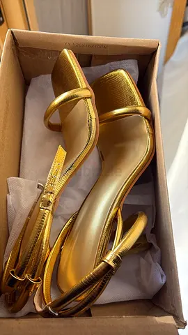 Golden high heels