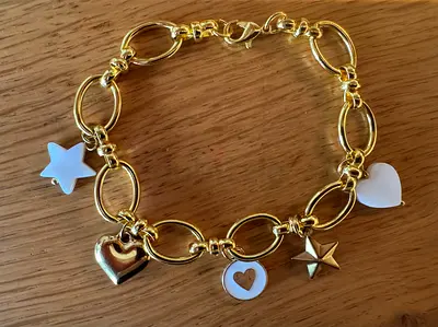 Charming Gold Colour Charm Bracelet with Hearts and Stars