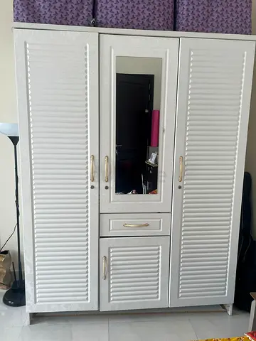 Stylish White Wardrobe with Mirror and Ample Storage