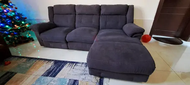 Cozy L-Shaped Blue Sectional Sofa. 4 people can sit. The Longer section can be dismantled easily