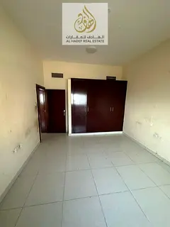 Three-bedroom apartment with a living room and built-in wardrobes, available for annual rent at a sp