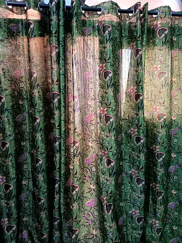Beautiful green curtains with curtain rod