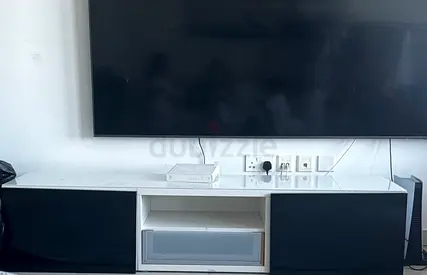 Stylish Entertainment Center with Sleek Finish to unite