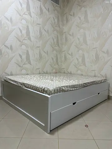 Stylish White Bed with Storage Drawers