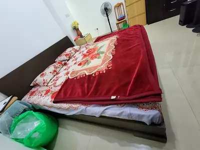 Wooden bed without mattress