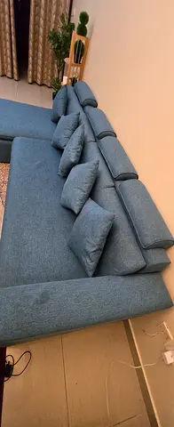Comfortable L-Shaped Sofa with Cushions in very good condition