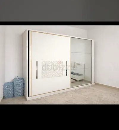 Sleek White Sliding Wardrobe with Glass Inserts
