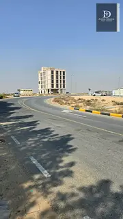 For Sale in Sharjah In the Tilal area Exceptional Location Prime Corner Residential Plot on Three S