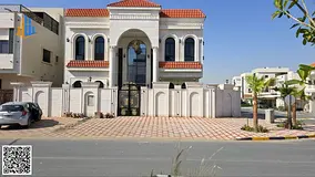 Invest and live in the best location in New Ajman, Al Helio 2. Classic corner villa with front setba