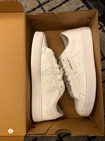 White adidas with gold text used once original (unisex) size 40.5, uk 7