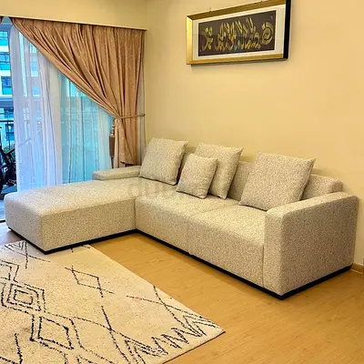 Modern L-Shaped Sofa with Chic Rug