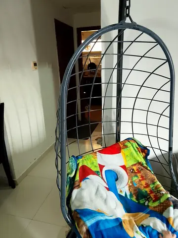 Stylish Hanging Egg Chair with Colorful Blanket