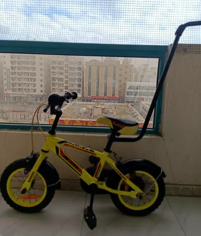 TOMMY ACTIVE ULTIMATE RACING KIDS BICYCLE @ AED 150 with back handle