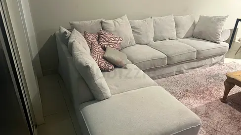 Comfortable L-Shaped Sofa with Cushions