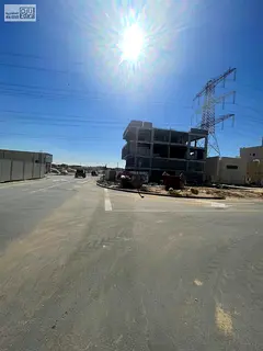 Corner residential land in Al Yasmin district, second plot from Al Rahmaniyah Street, quiet strategi