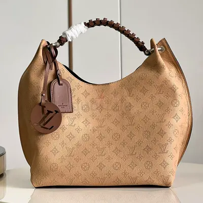 Louis vuitton Carmel Hobo Bag in Mahina Calf Leather With Monogram Perforations And Braided Handle