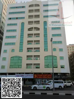 Two-bedroom apartment with a living room, two bathrooms, and a balcony in Al Qasimia area, Sharjah.