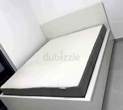 IKEA queen‑size bed (160 × 200 cm) with 2 storage drawers underneath and an IKEA mattress