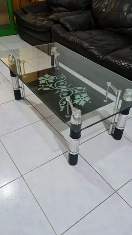 Elegant Glass Coffee Table with Decorative Design