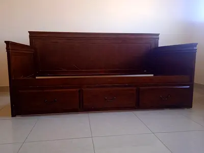 Elegant solid Wooden single Bed with Storage Drawers underneath on wheels. Made in Vietnam..